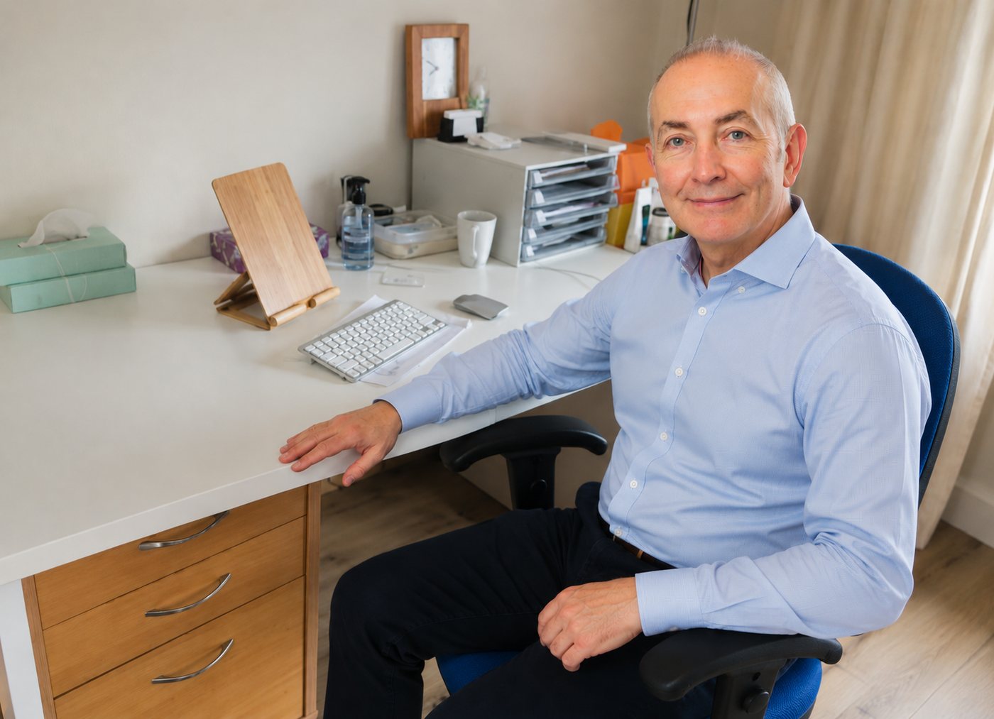 Dr Andrew Greenland in his consulting room at The Maris Practice, Twickenham
